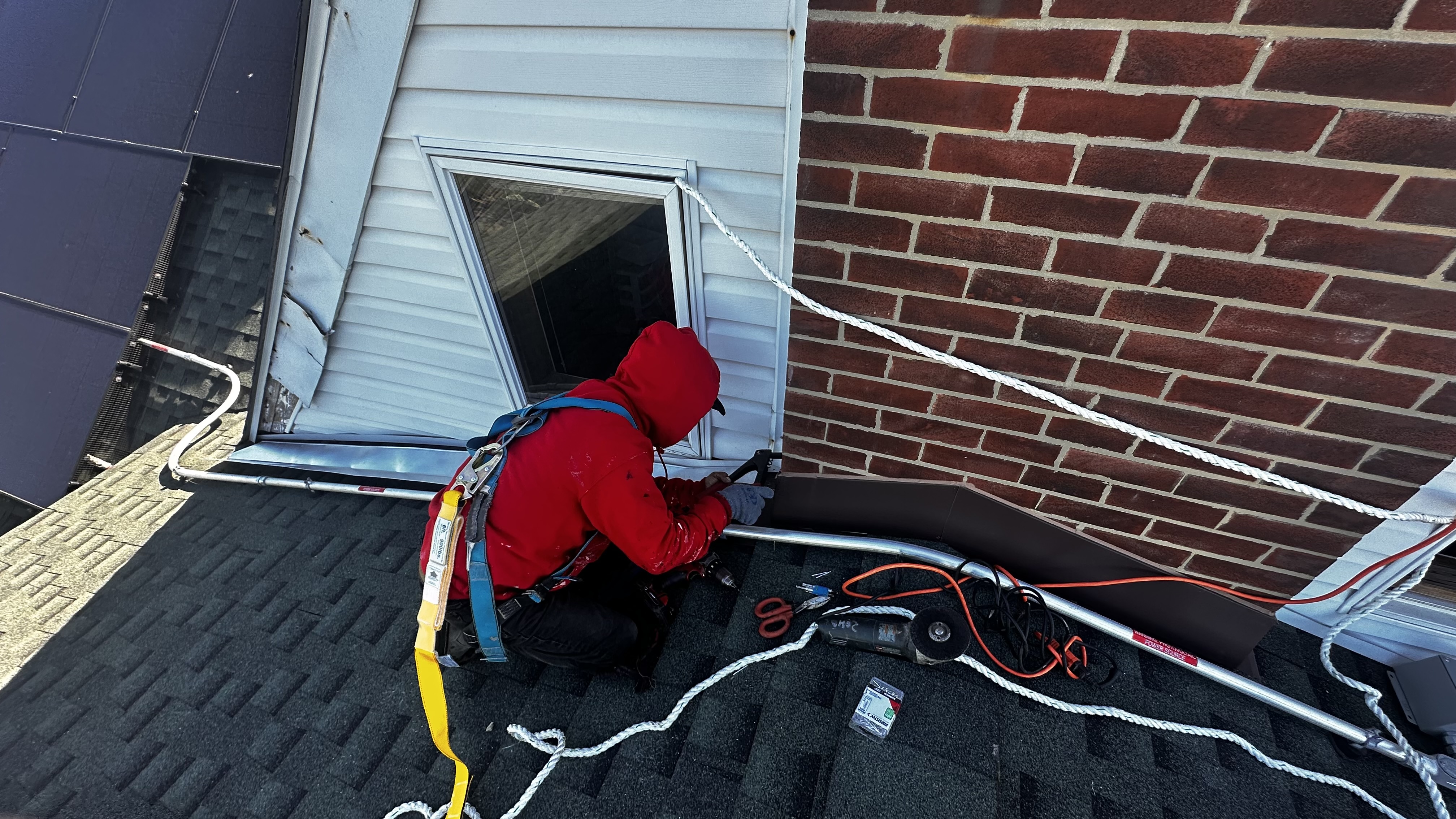 Paitan Contracting crew working on residential roof in NYC