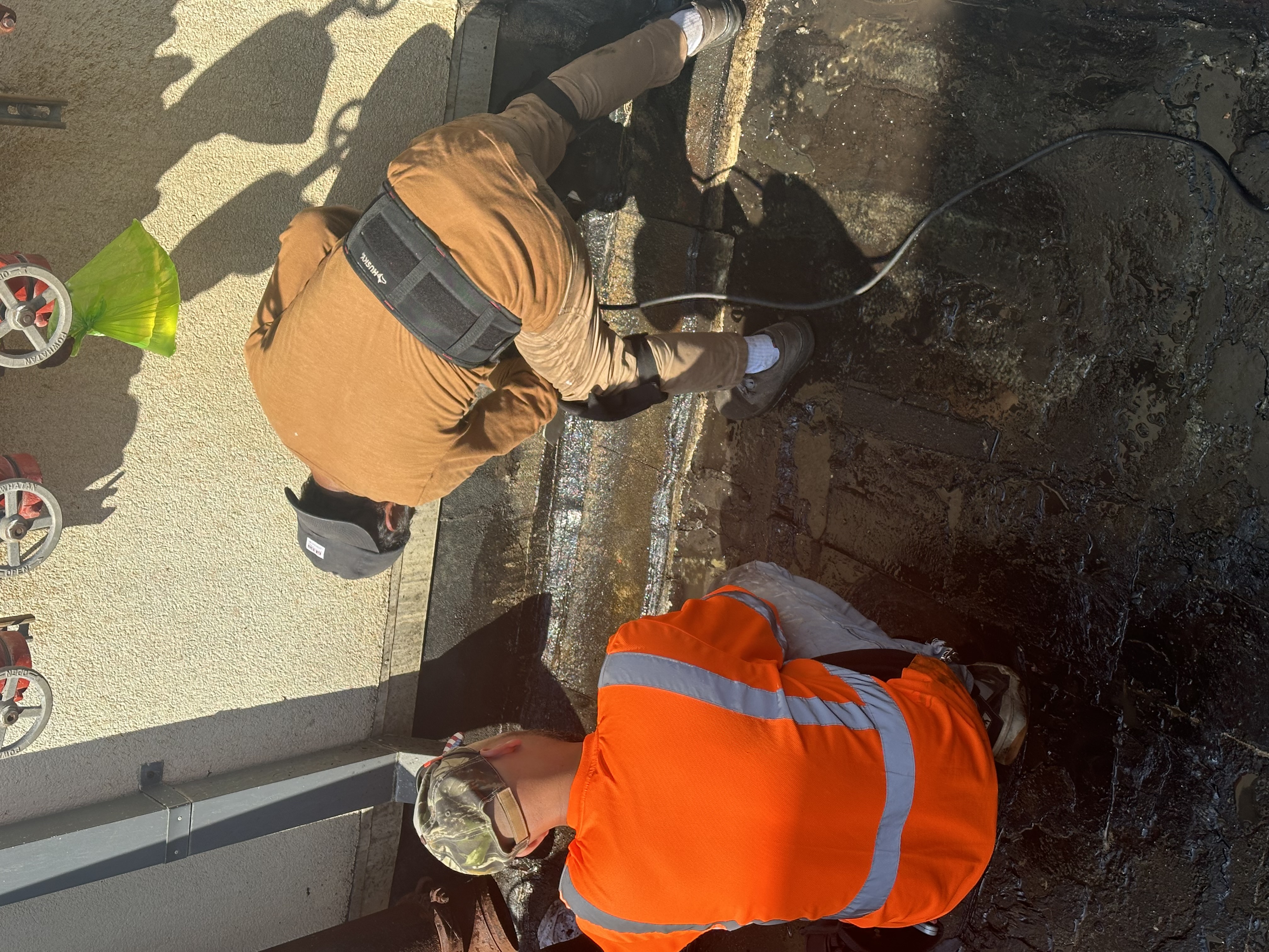 Waterproofing and masonry crew on site